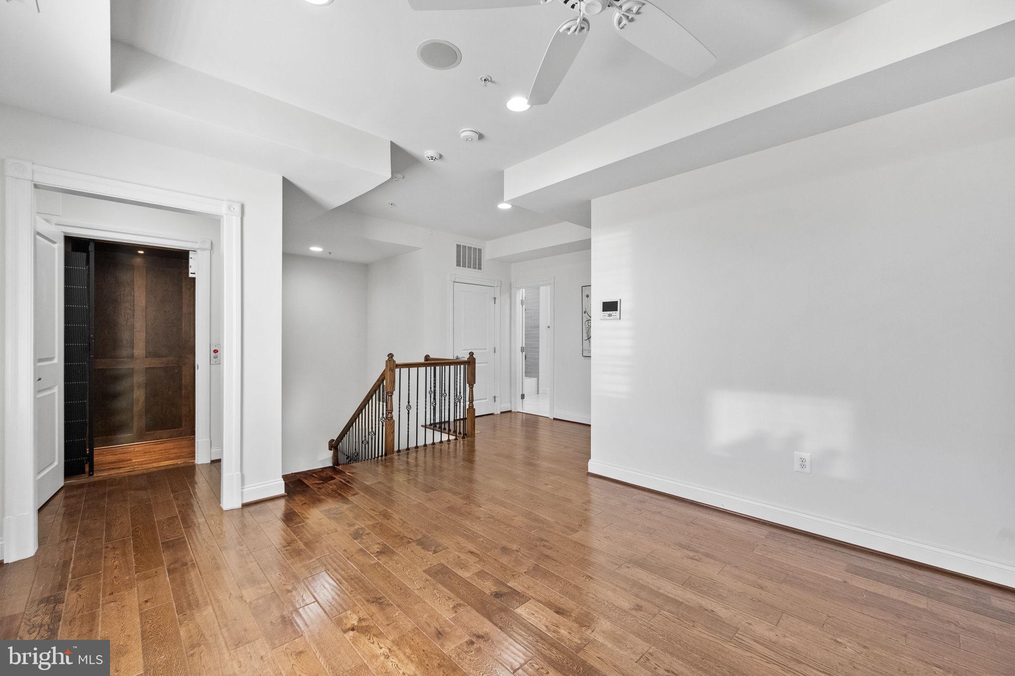 1411 Ridgeview Way Washington, DC 20007 - Photo 46 of 56 wooden floor in an empty room with a window