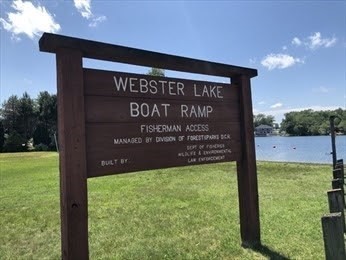 169 Upper Gore Road Webster, MA 01570 - Photo 4 of 4 a sign on the side of the building