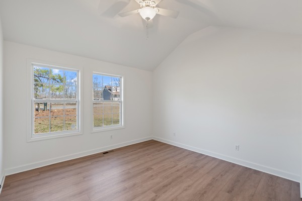 5805 Washer Road Lyles, TN 37098 - Photo 15 of 44 an empty room with wooden floor and windows