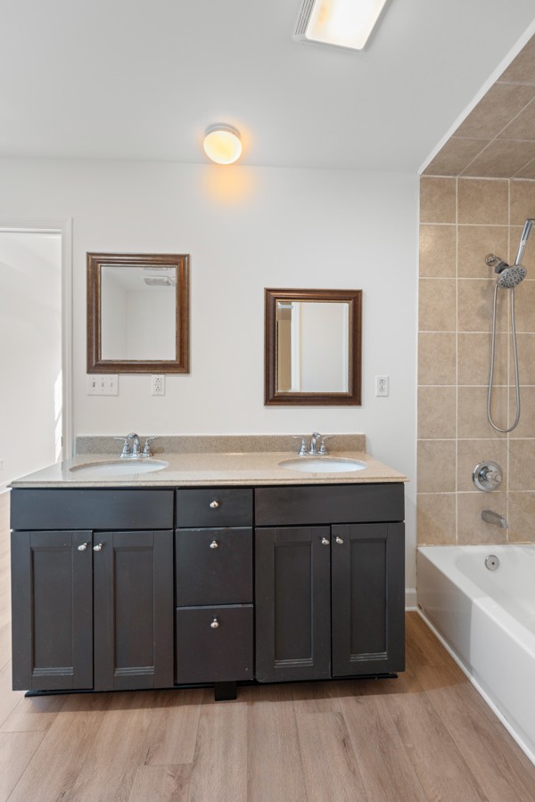 5805 Washer Road Lyles, TN 37098 - Photo 20 of 44 a bathroom with a tub sink and mirror