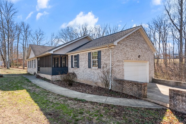 5805 Washer Road Lyles, TN 37098 - Photo 2 of 44 a front view of a house with garden