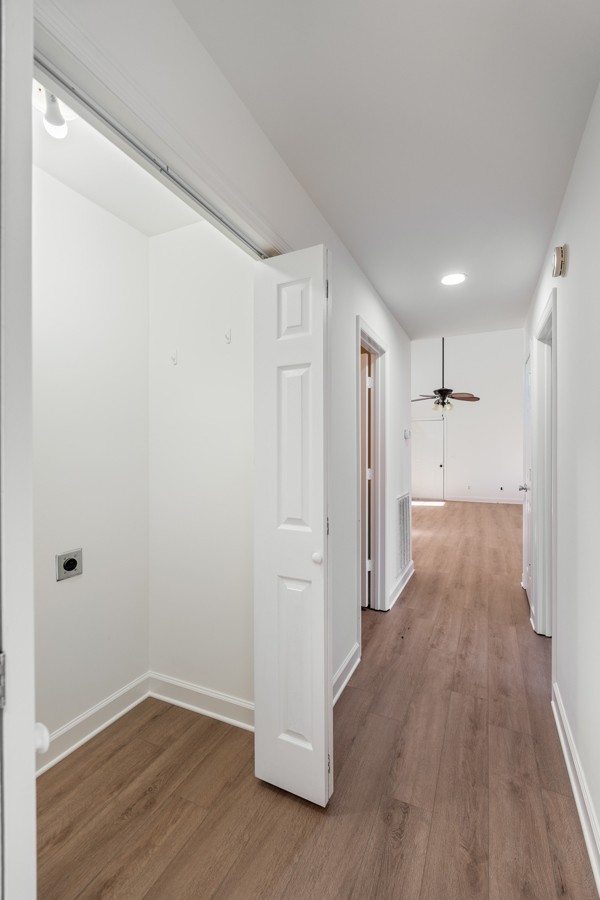 5805 Washer Road Lyles, TN 37098 - Photo 24 of 44 a view of a hallway with wooden floor and closet