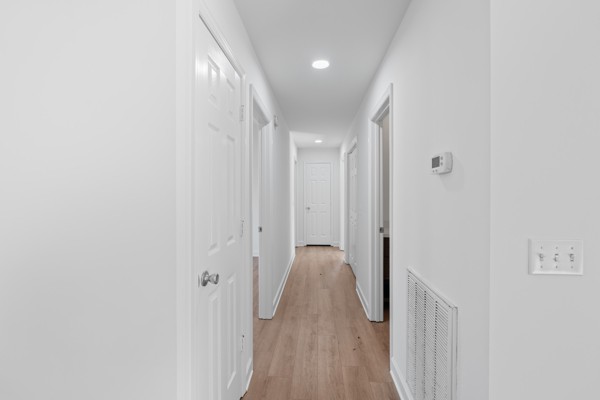 5805 Washer Road Lyles, TN 37098 - Photo 25 of 44 a view of a hallway with wooden floor