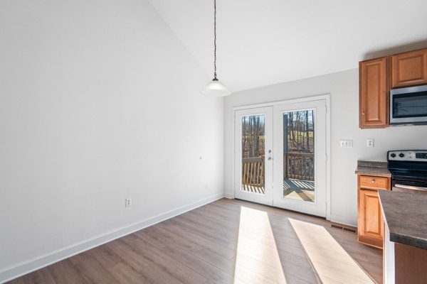 5805 Washer Road Lyles, TN 37098 - Photo 9 of 44 a view of an empty room with window and wooden floor