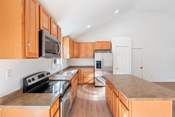 5805 Washer Road Lyles, TN 37098 - Photo 10 of 44 a kitchen with stainless steel appliances granite countertop a sink stove and refrigerator