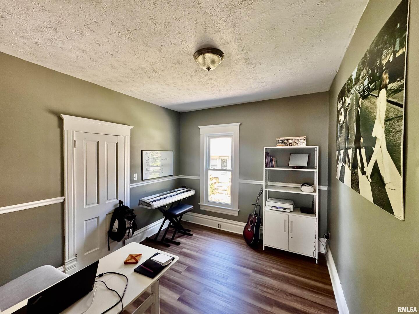 1215 13th Street Viola, IL 61486 - Photo 16 of 35 a room with furniture and a window