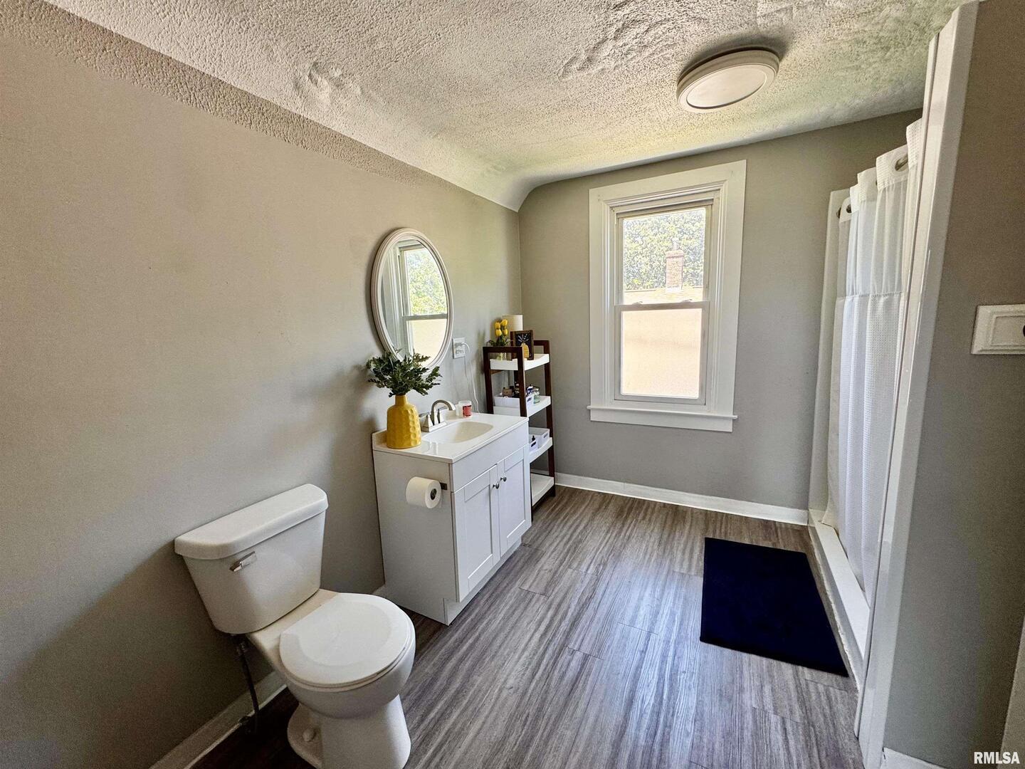 1215 13th Street Viola, IL 61486 - Photo 21 of 35 a bathroom with a sink and a mirror