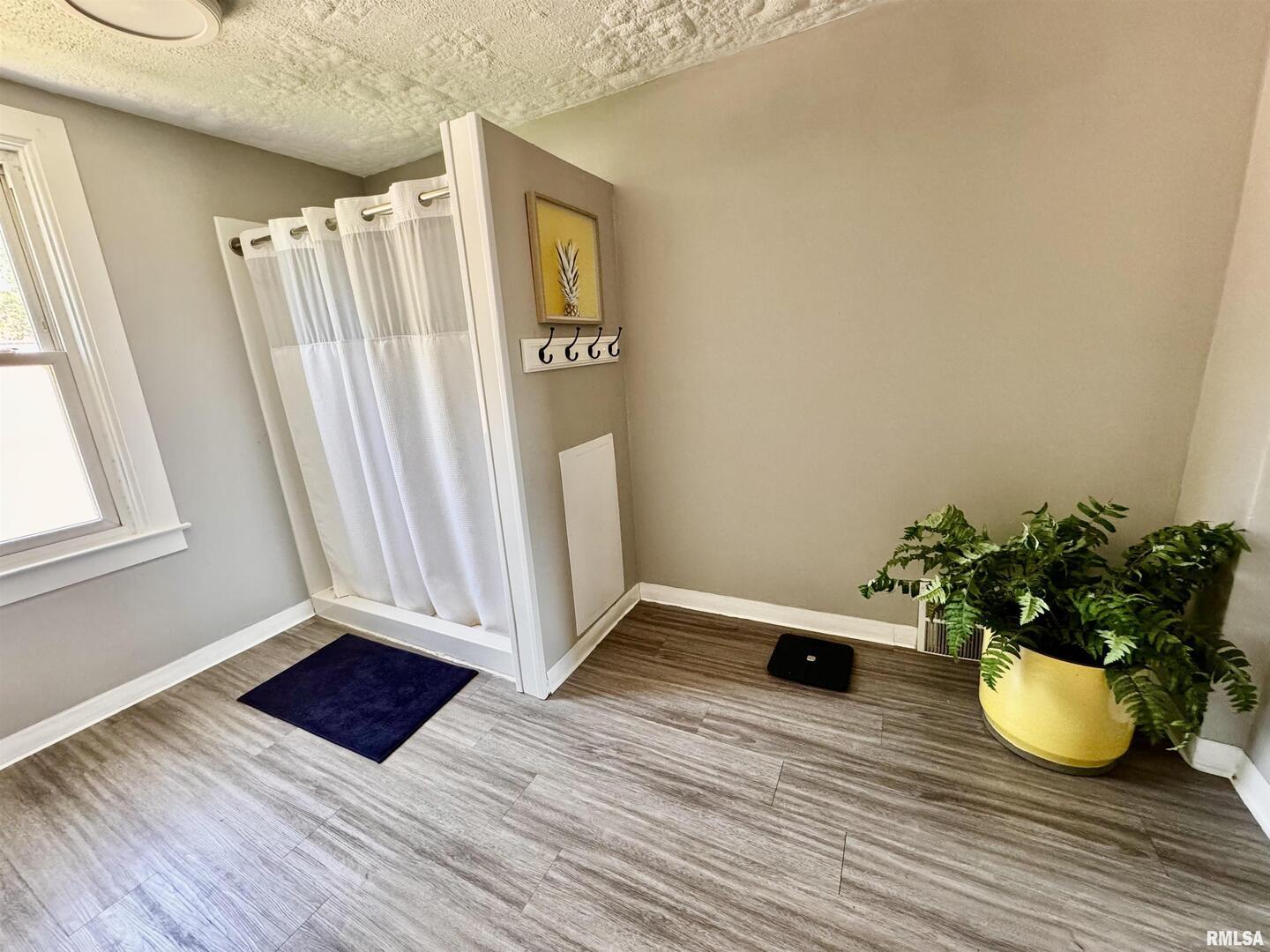 1215 13th Street Viola, IL 61486 - Photo 22 of 35 a view of a room with wooden floor and chair