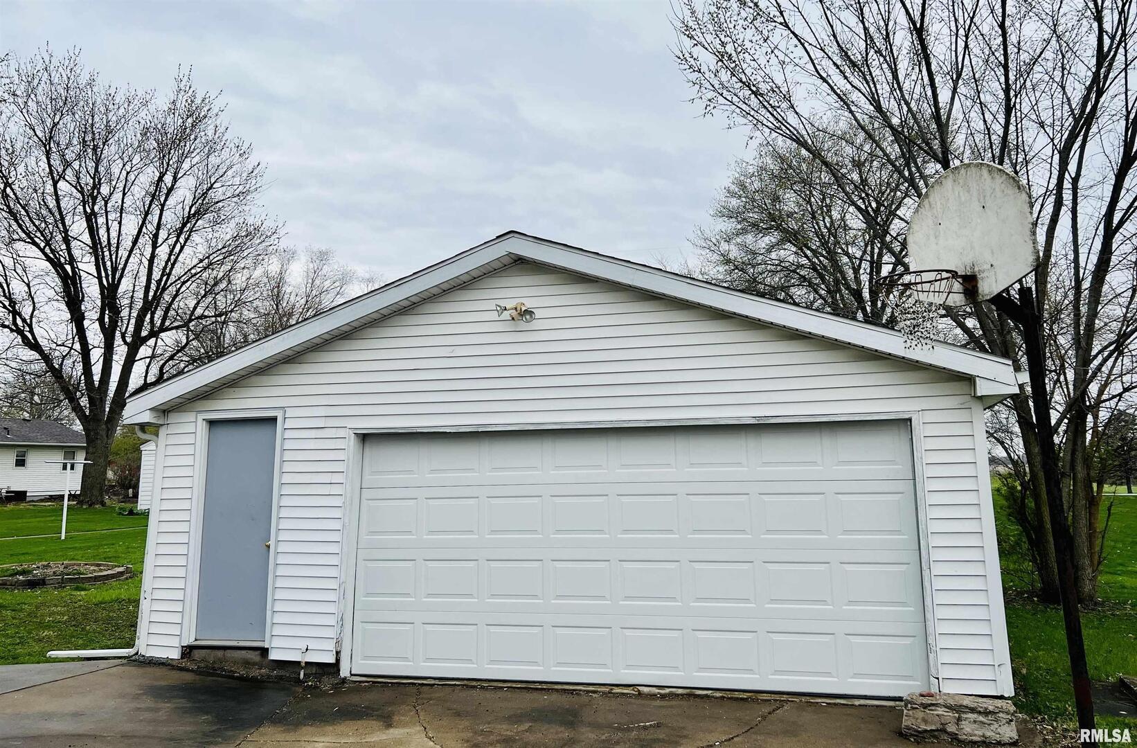 1215 13th Street Viola, IL 61486 - Photo 24 of 35 a front view of a house with a yard