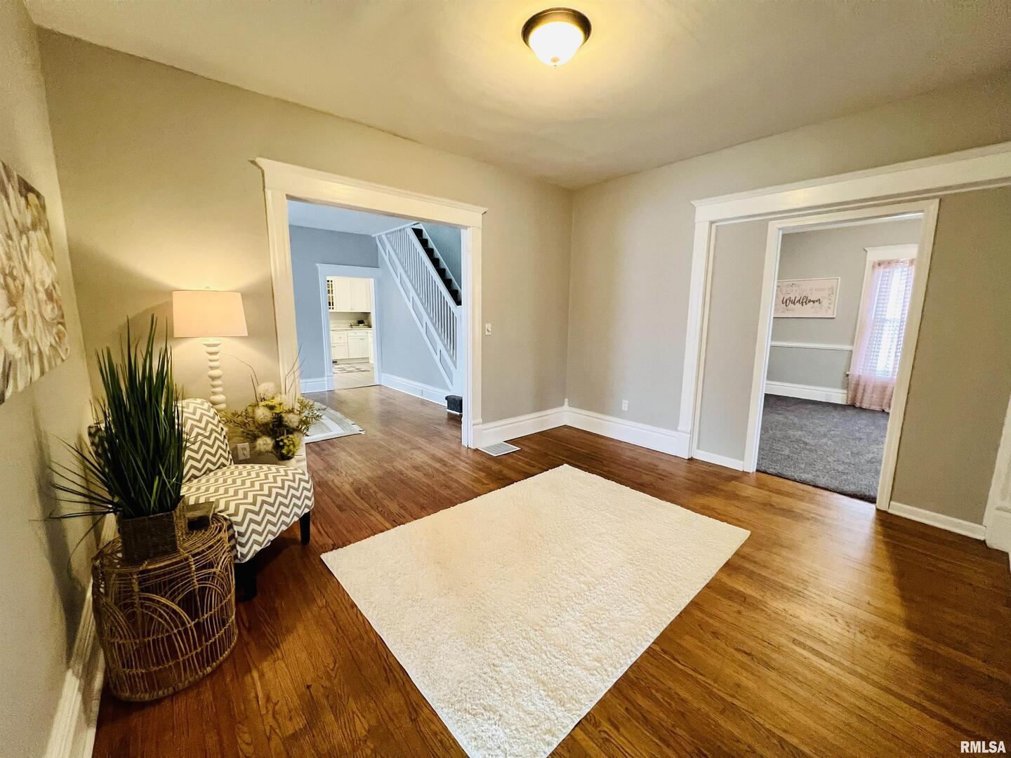 1215 13th Street Viola, IL 61486 - Photo 29 of 35 a bedroom with furniture and a wooden floor