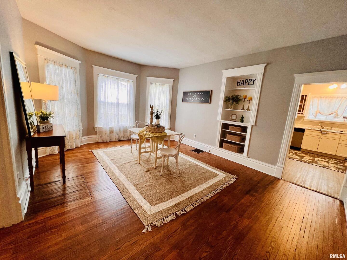 1215 13th Street Viola, IL 61486 - Photo 31 of 35 a living room with furniture and a wooden floor