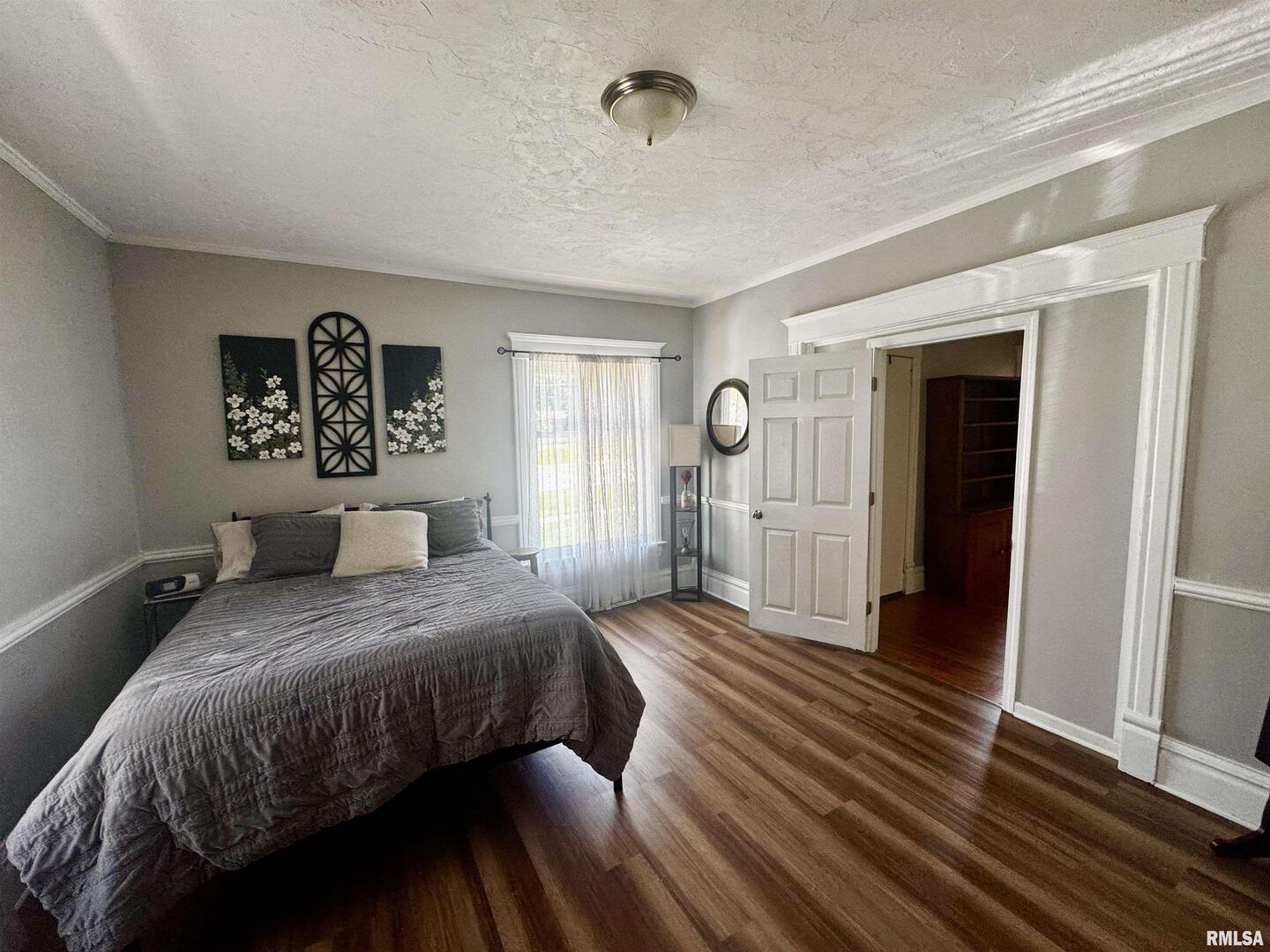 1215 13th Street Viola, IL 61486 - Photo 8 of 35 a bedroom with a bed and a large mirror