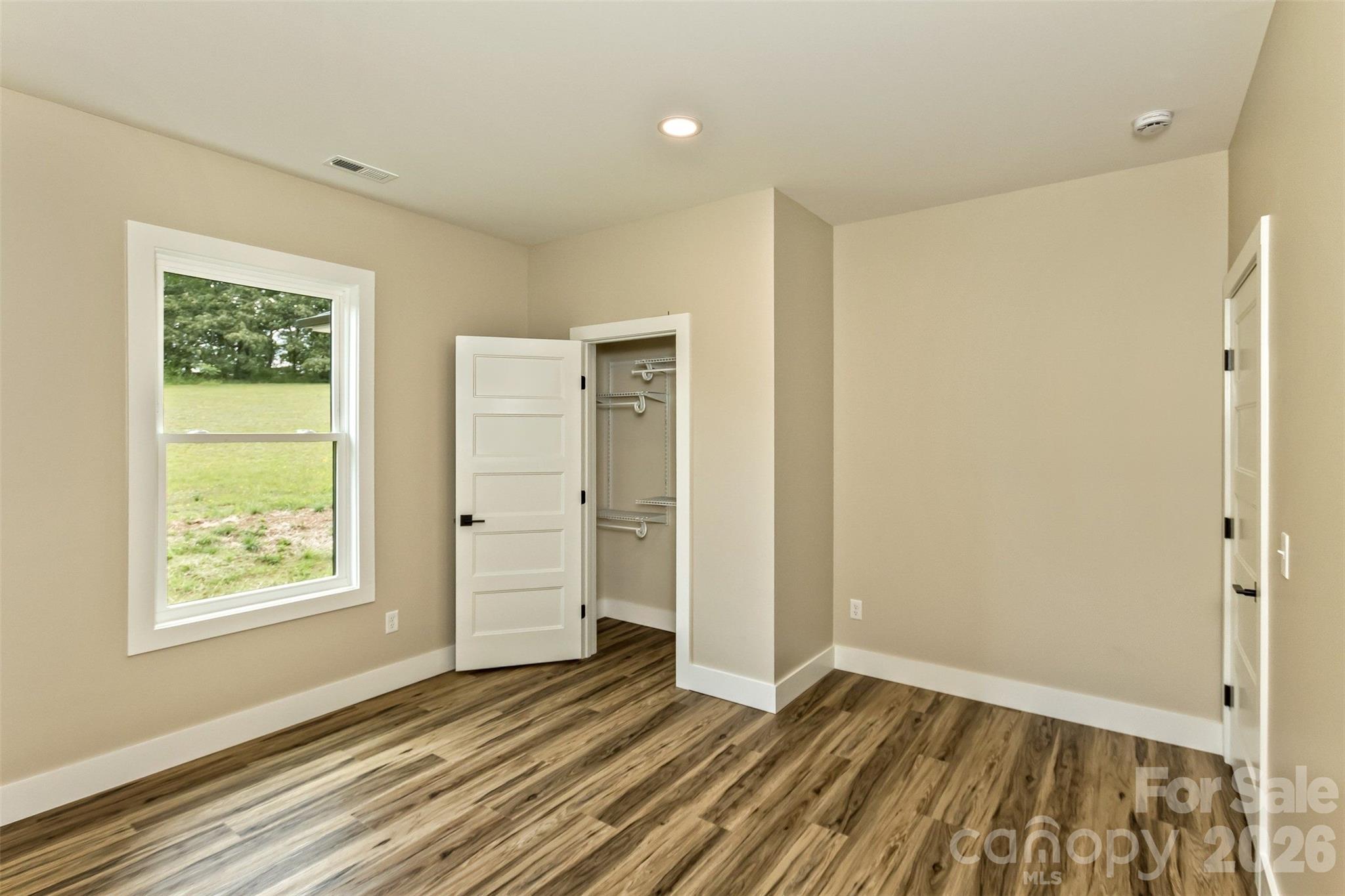 112 Peyton Elaine Road Clyde, NC 28721 - Photo 26 of 35 a view of an empty room with window and closet area