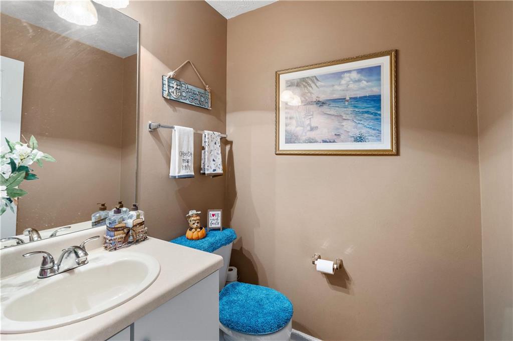 1380 Pebble Beach Lane Hampton, GA 30228 - Photo 23 of 59 a bathroom with a sink and a mirror