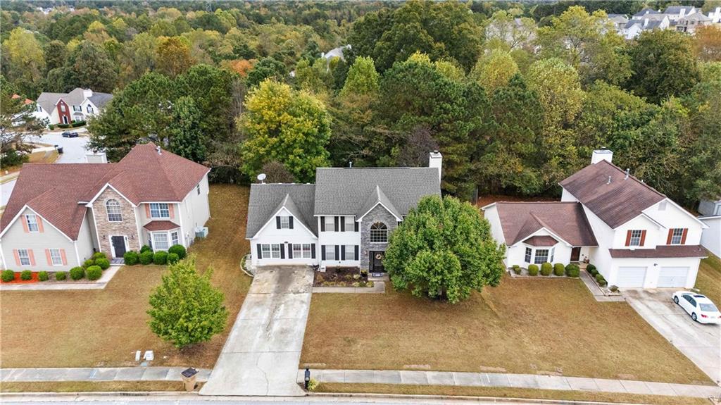 1380 Pebble Beach Lane Hampton, GA 30228 - Photo 3 of 59 an aerial view of residential houses with yard