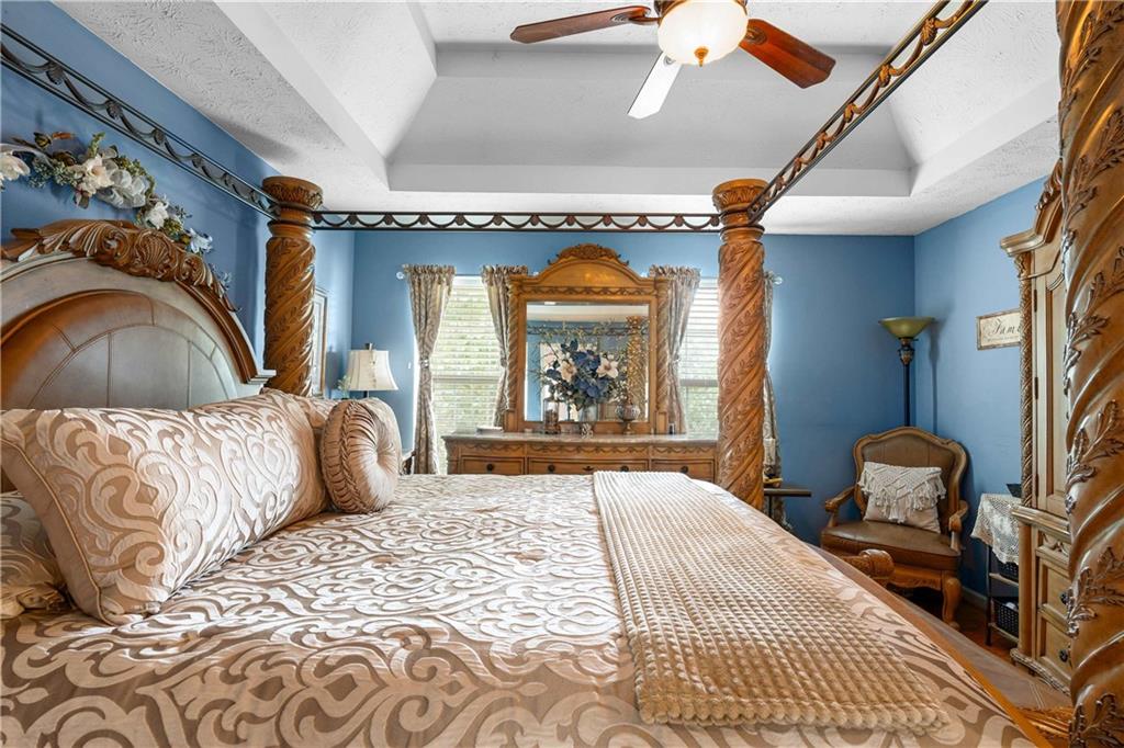 1380 Pebble Beach Lane Hampton, GA 30228 - Photo 32 of 59 a bedroom with a bed and window