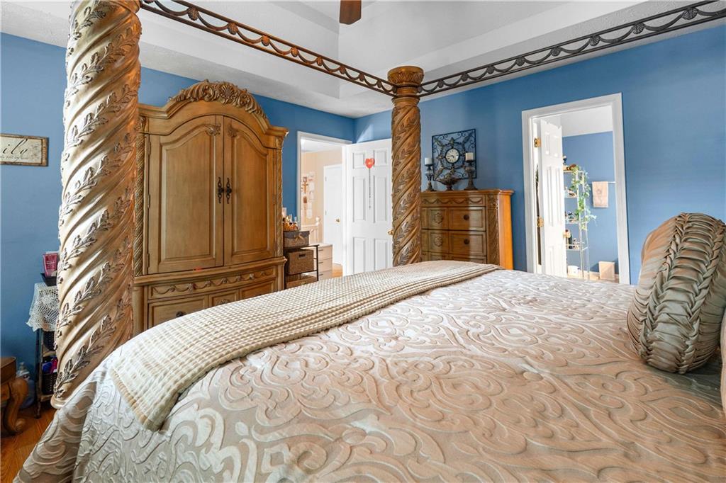 1380 Pebble Beach Lane Hampton, GA 30228 - Photo 34 of 59 a bedroom with a bed and a mirror