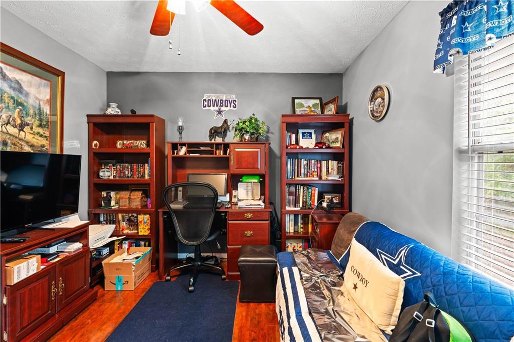 1380 Pebble Beach Lane Hampton, GA 30228 - Photo 37 of 59 a view of a workspace with furniture and a window