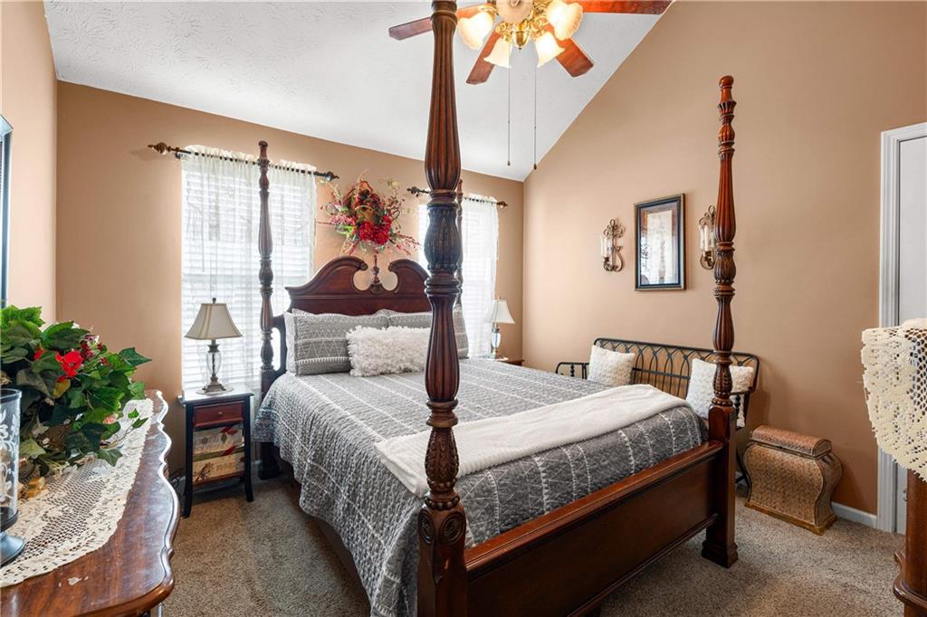 1380 Pebble Beach Lane Hampton, GA 30228 - Photo 39 of 59 a bedroom with a bed and a potted plant