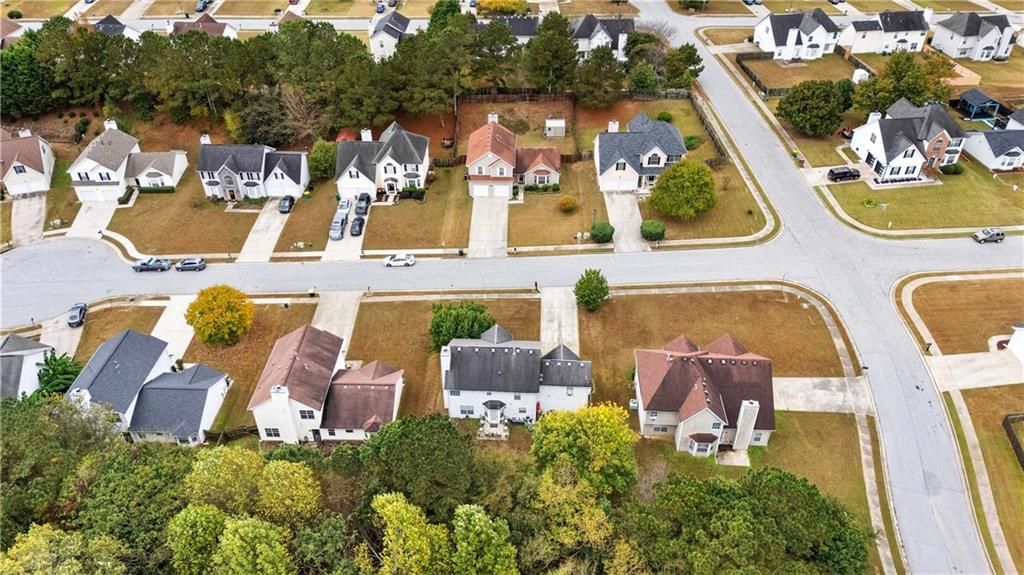 1380 Pebble Beach Lane Hampton, GA 30228 - Photo 4 of 59 an aerial view of a house with swimming pool and outdoor seating