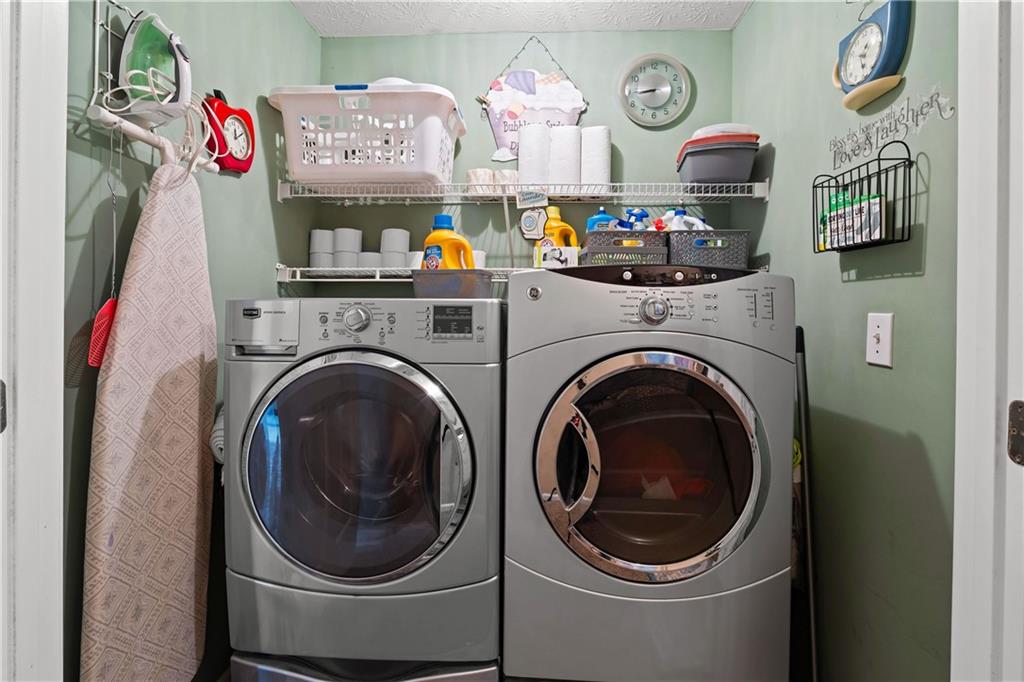 1380 Pebble Beach Lane Hampton, GA 30228 - Photo 43 of 59 a utility room with dryer and washer