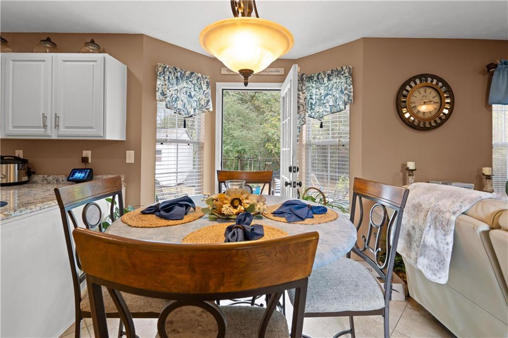 1380 Pebble Beach Lane Hampton, GA 30228 - Photo 47 of 59 a dining room with furniture and window