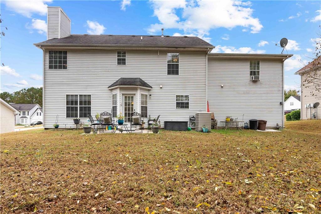 1380 Pebble Beach Lane Hampton, GA 30228 - Photo 48 of 59 a front view of a house with yard