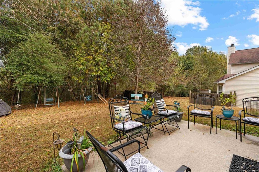 1380 Pebble Beach Lane Hampton, GA 30228 - Photo 49 of 59 a view of a backyard with sitting area