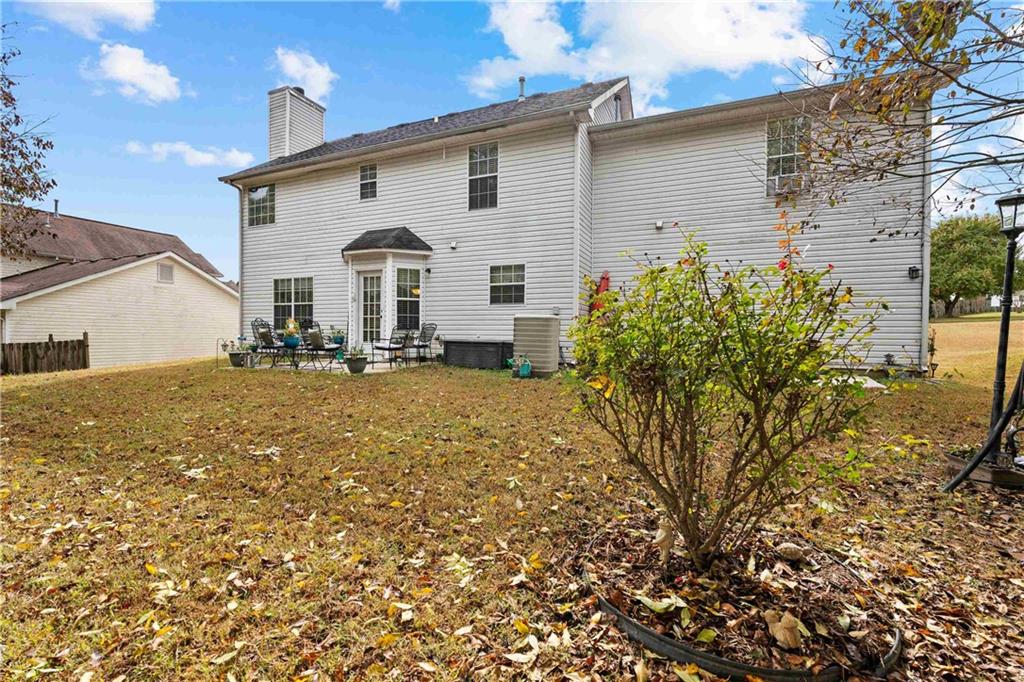 1380 Pebble Beach Lane Hampton, GA 30228 - Photo 53 of 59 a view of a house with a yard