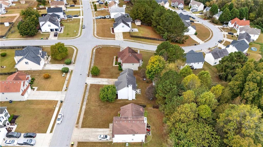 1380 Pebble Beach Lane Hampton, GA 30228 - Photo 57 of 59 an aerial view of residential house with outdoor space and parking
