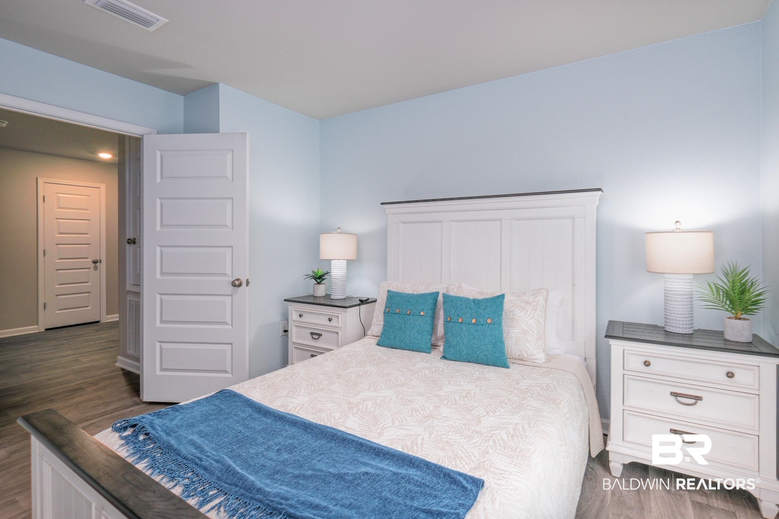 7425 Coppin Drive Foley, AL 36535 - Photo 24 of 41 Bedroom featuring dark hardwood / wood-style floors