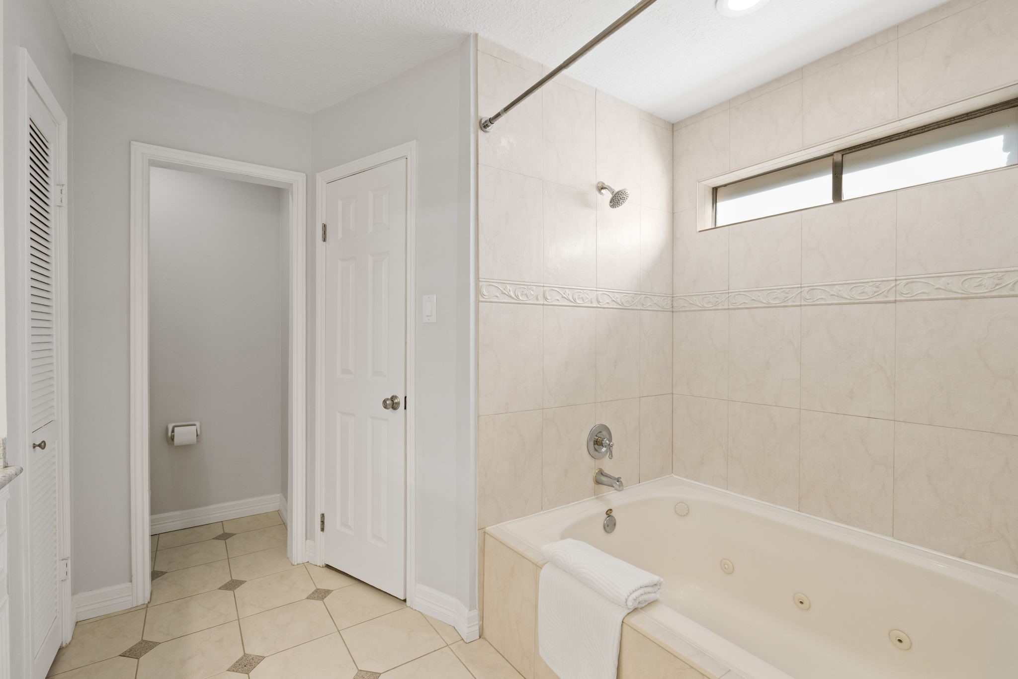 9203 Godstone Lane Spring, TX 77379 - Photo 25 of 49 Whether you prefer a luxurious bath or hot shower, this combination tub and shower offers you both options.