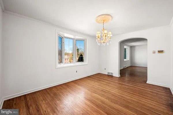 a view of livingroom with hardwood floor and hallway