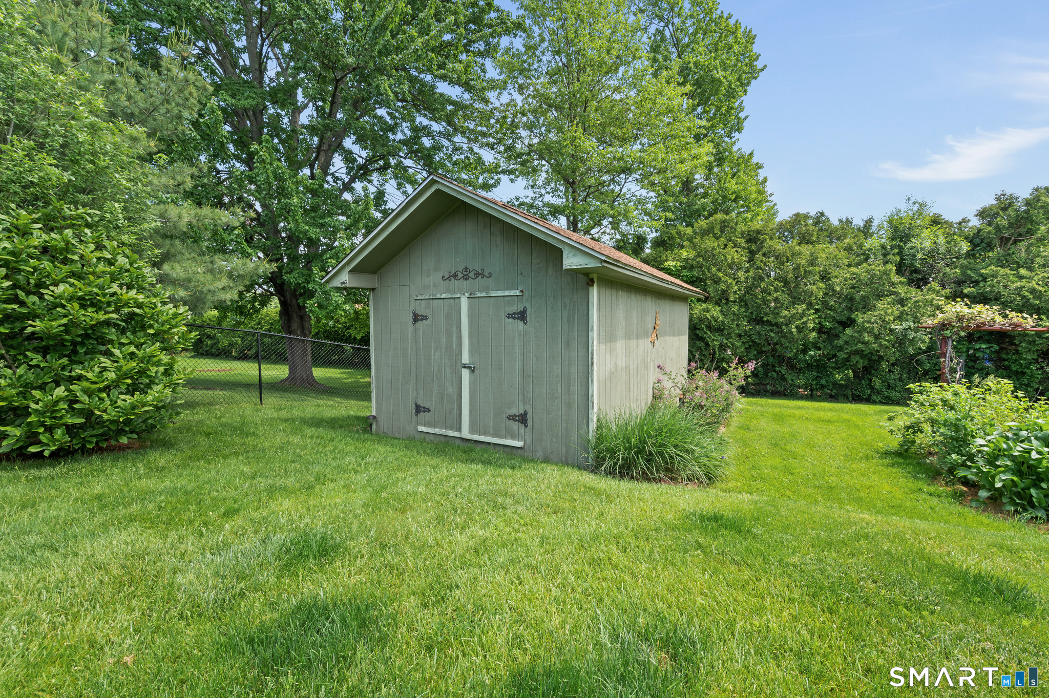 201 Ridge Crest Circle Wethersfield, CT 06109 - Photo 28 of 35 a view of a house with a yard and plants