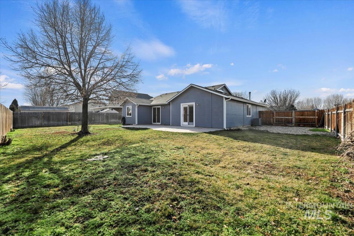 612 Goshawk Avenue Middleton, ID 83644 - Photo 32 of 36 Rear view of property featuring a patio area and a fenced backyard
