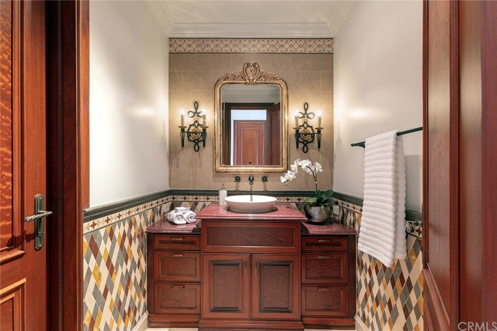 32 Boulder View Irvine, CA 92603 - Photo 32 of 73 a bathroom with a sink and a mirror