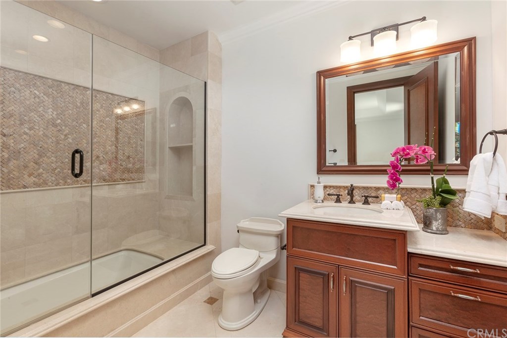 32 Boulder View Irvine, CA 92603 - Photo 41 of 73 a bathroom with a sink toilet vanity and shower