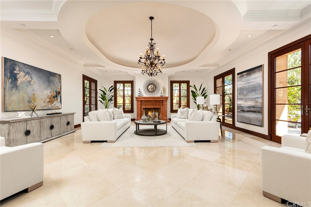 32 Boulder View Irvine, CA 92603 - Photo 5 of 73 a living room with furniture and a chandelier