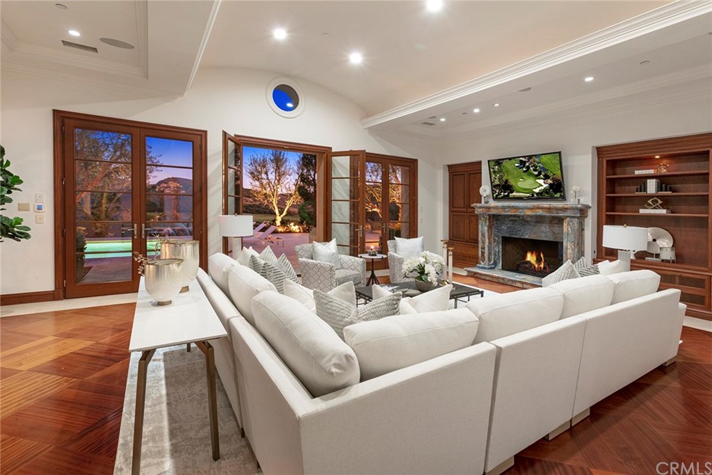 32 Boulder View Irvine, CA 92603 - Photo 63 of 73 a living room with furniture fireplace and flat screen tv