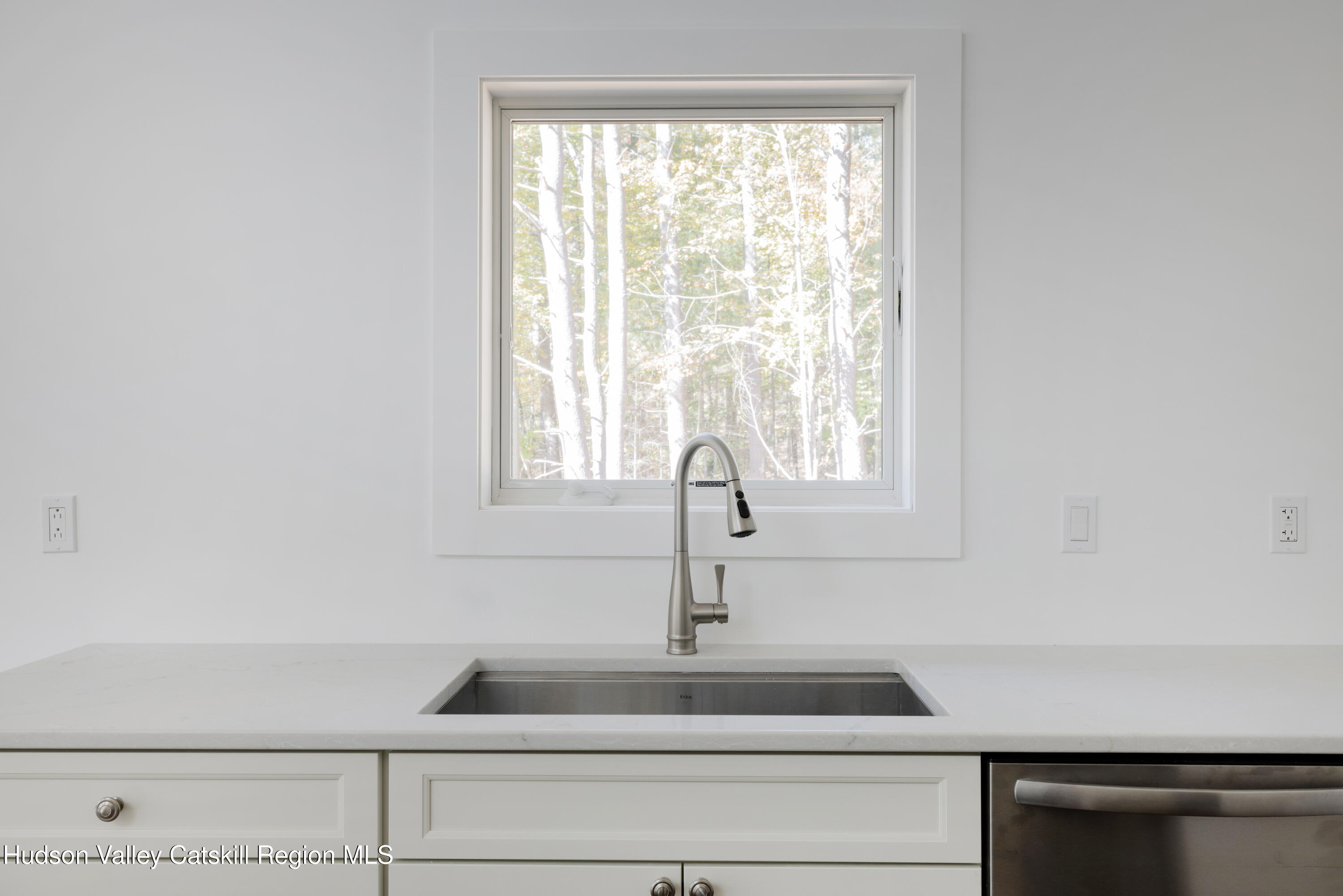 246 South Road Ruby, NY 12475 - Photo 11 of 35 a close view of a sink a mirror and a window