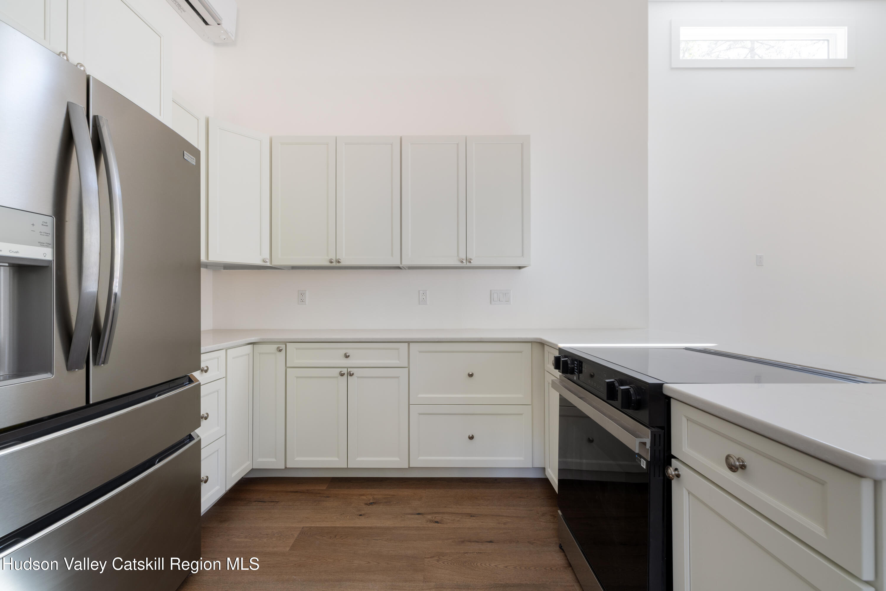 246 South Road Ruby, NY 12475 - Photo 12 of 35 a kitchen with white cabinets and a stainless steel appliances