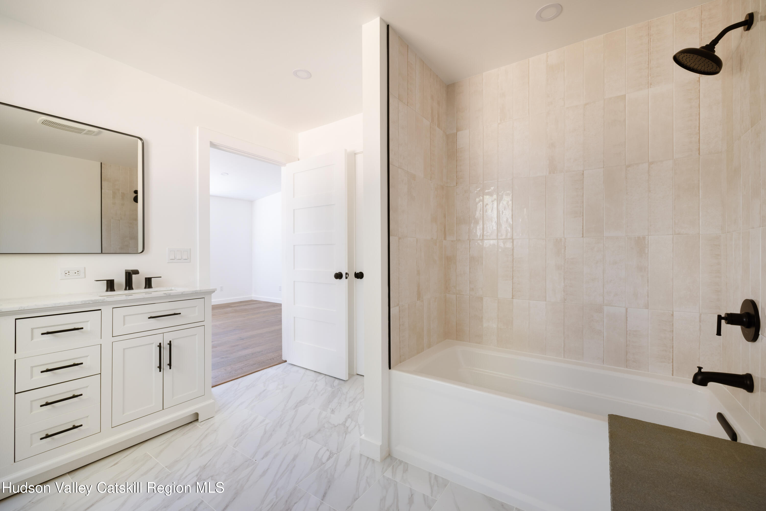 246 South Road Ruby, NY 12475 - Photo 15 of 35 a bathroom with a tub sink and mirror