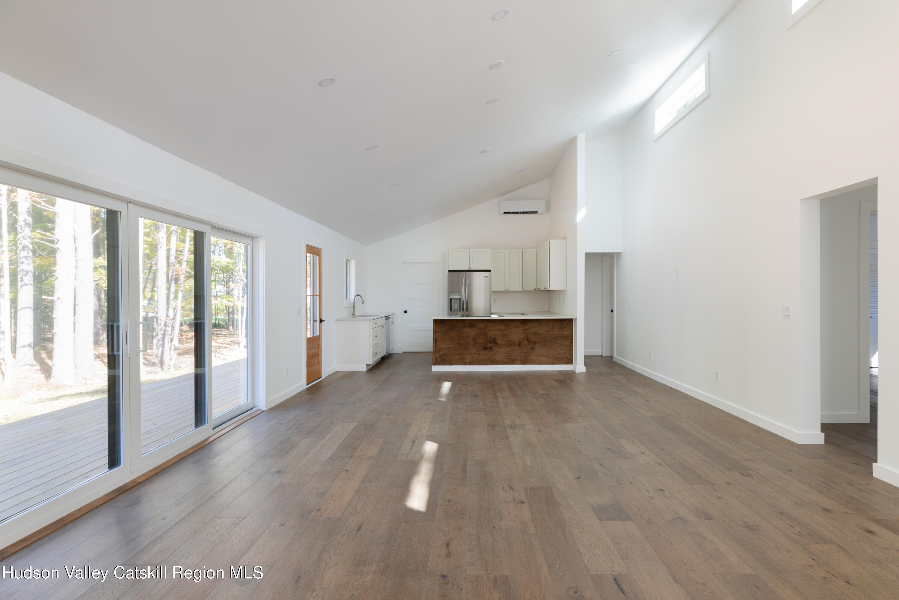 246 South Road Ruby, NY 12475 - Photo 10 of 35 a view of empty room with wooden floor and fireplace
