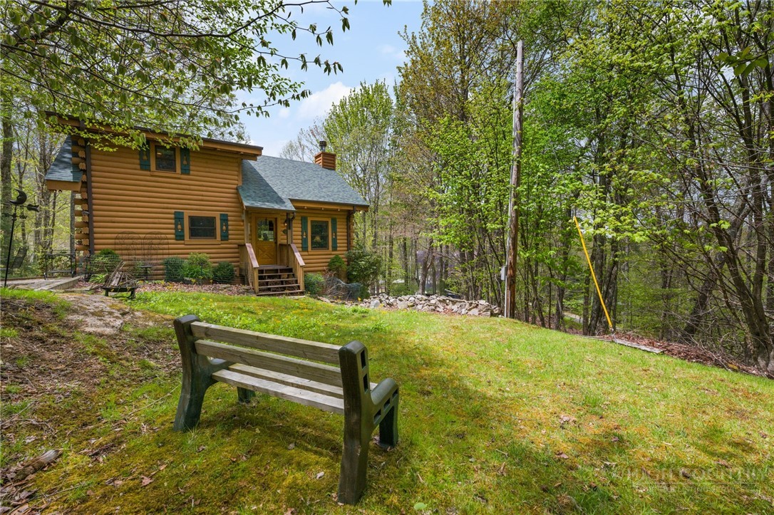 259 Greenbriar Road Beech Mountain, NC 28604 - Photo 35 of 41 a view of a house with backyard porch and sitting area