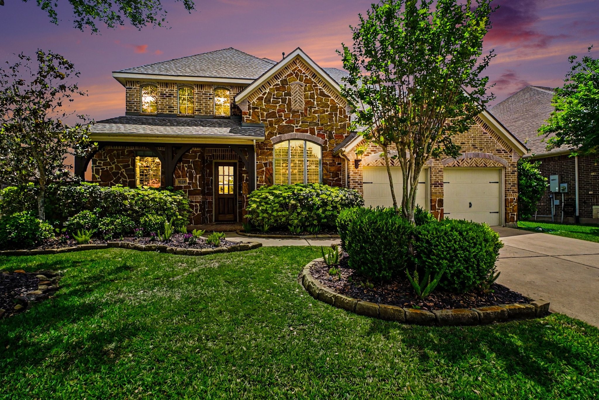 8210 Thunder Ridge Way Missouri City, TX 77459 - Photo 37 of 42 Exterior front facade as seen at dusk.