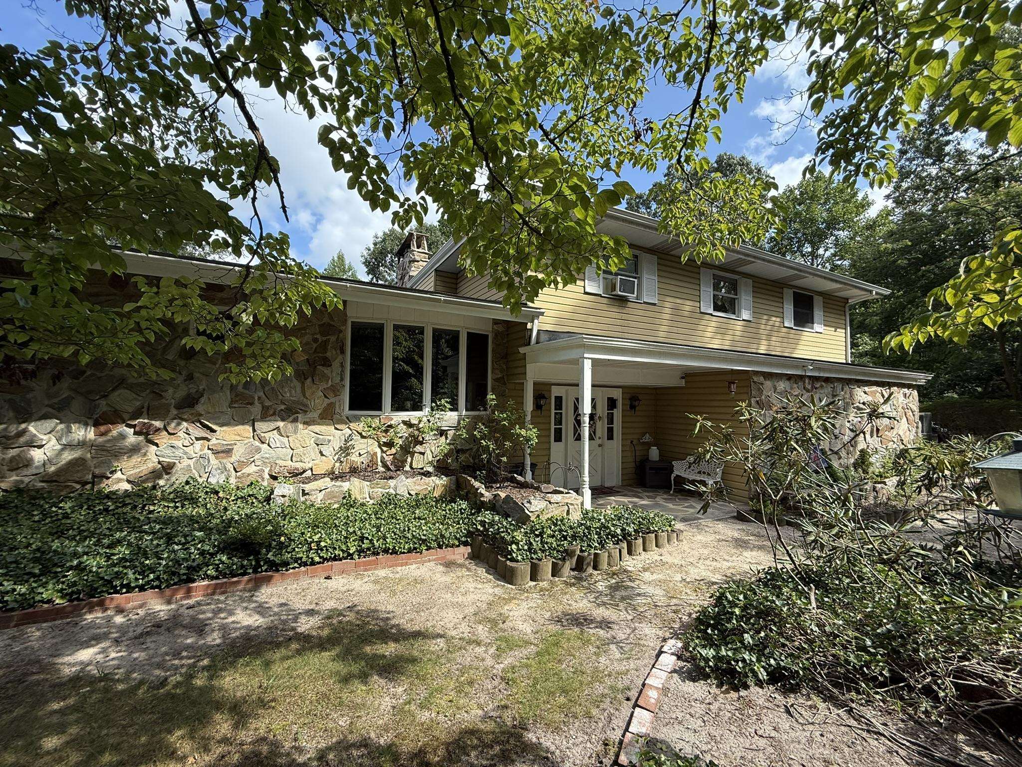 506 Hagen Road South Dennis, NJ 08210 - Photo 1 of 49 a front view of house with yard and trees around