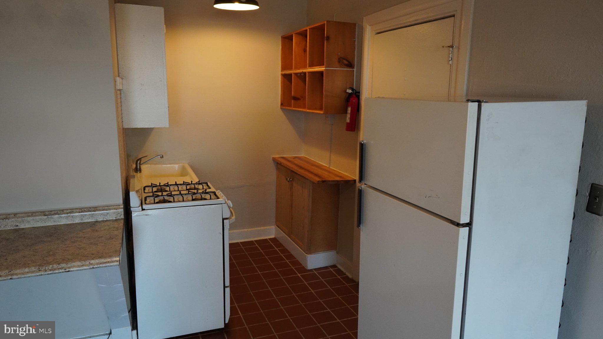 917 North Calvert Street, Unit 6 Baltimore, MD 21202 - Photo 6 of 10 Cozy kitchen with modern essentials.