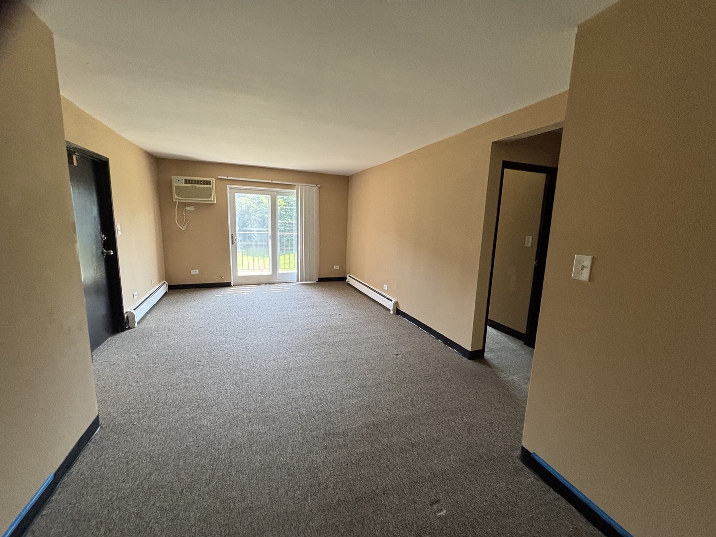 701 Spruce Court, Unit 4 Vernon Hills, IL 60061 - Photo 7 of 18 a view of an empty room with a window