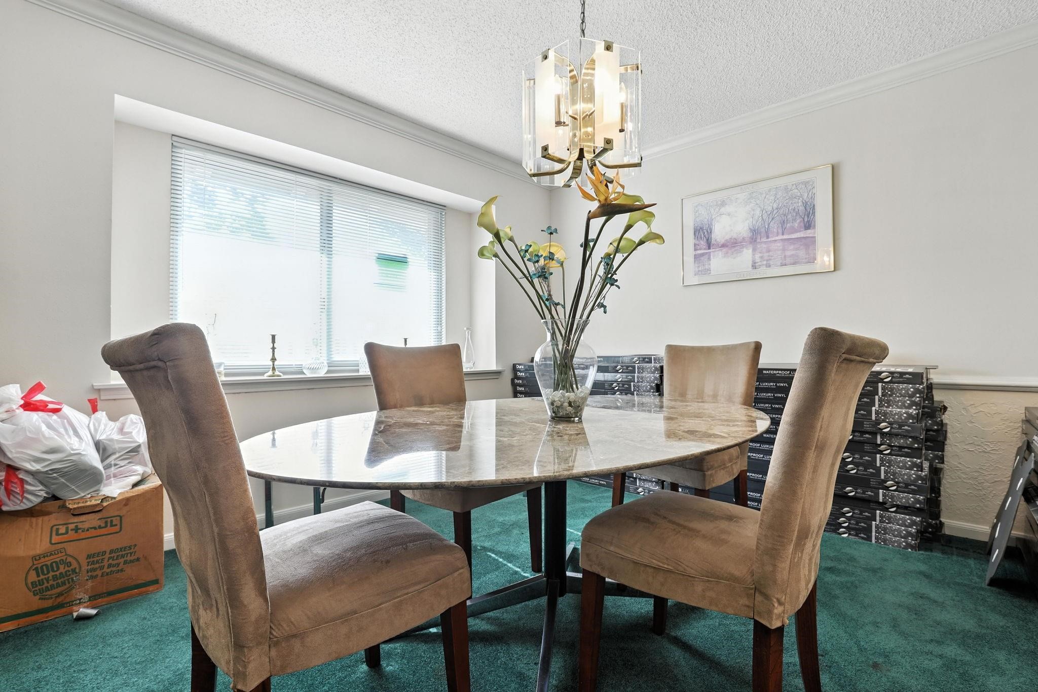 2910 Riata Lane Houston, TX 77080 - Photo 11 of 23 a view of a dining room with furniture a chandelier and wooden floor
