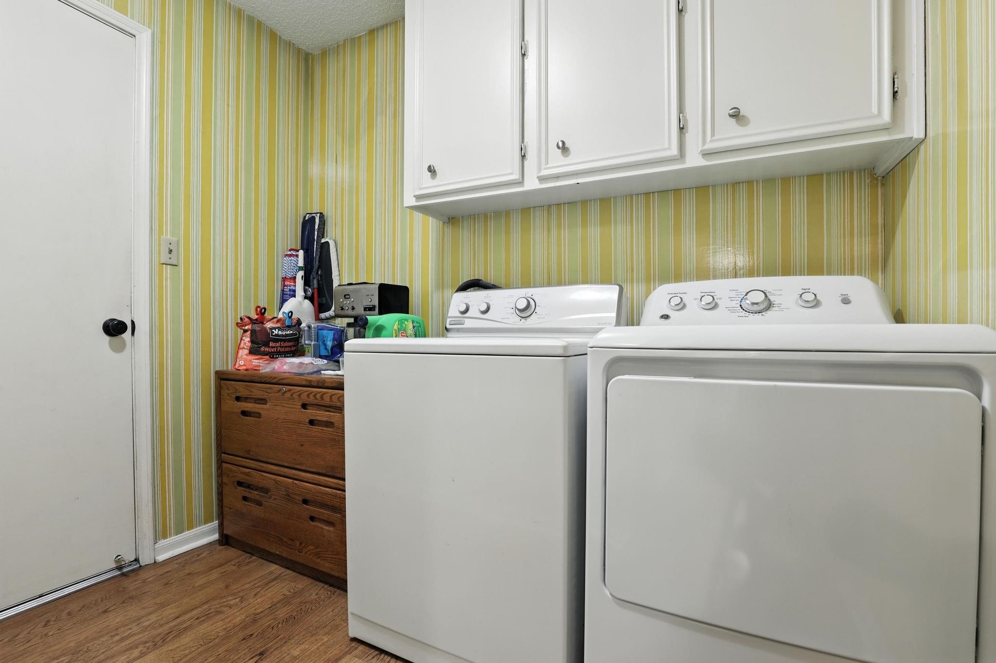 2910 Riata Lane Houston, TX 77080 - Photo 12 of 23 a view of storage and utility room with washer and dryer